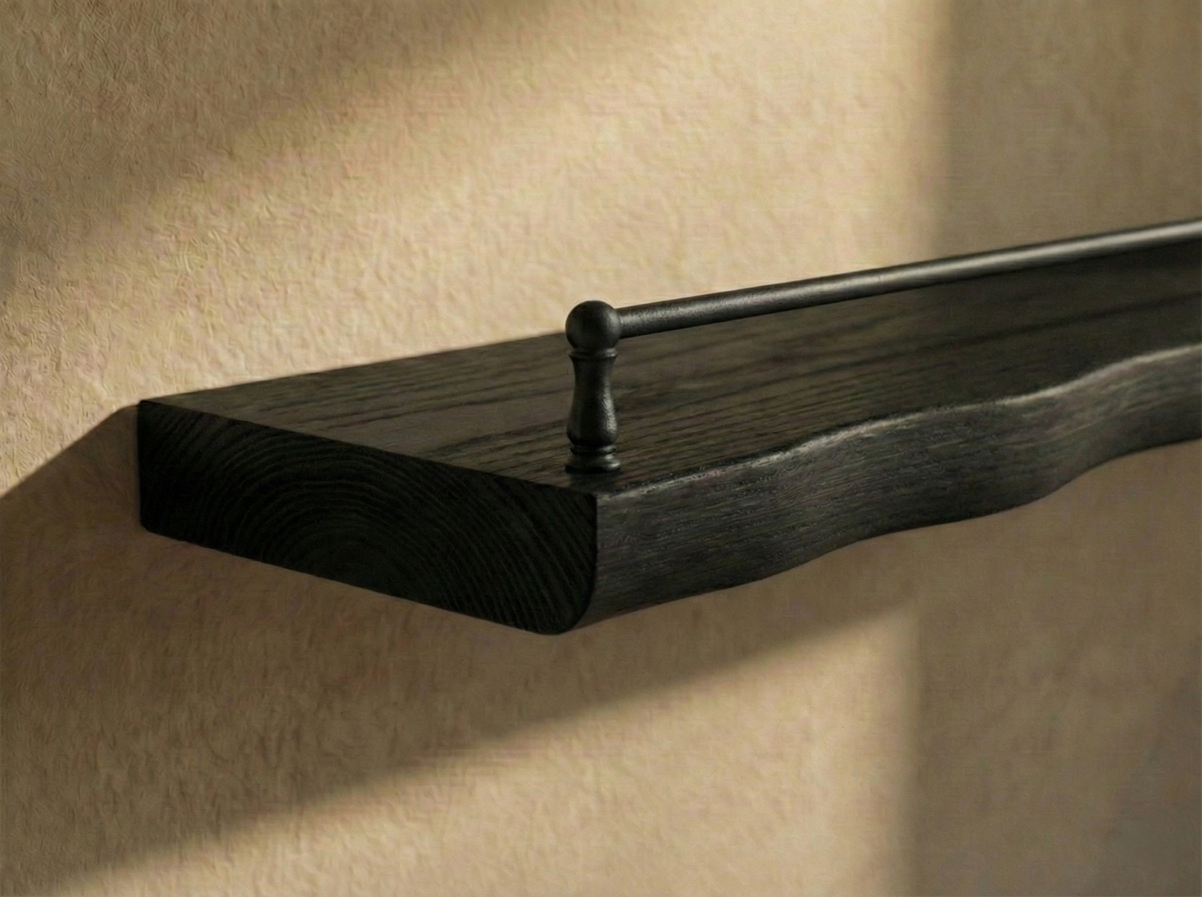 Solid black oak live edge shelf with gallery rail for wall display, showcasing natural wood grain and sleek modern design.