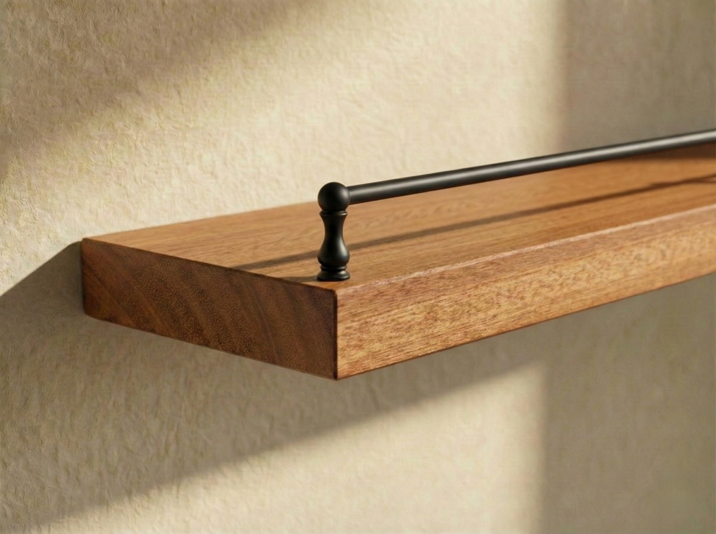Solid mahogany floating shelf with gallery rail, ideal for stylish storage and display in modern home interiors.