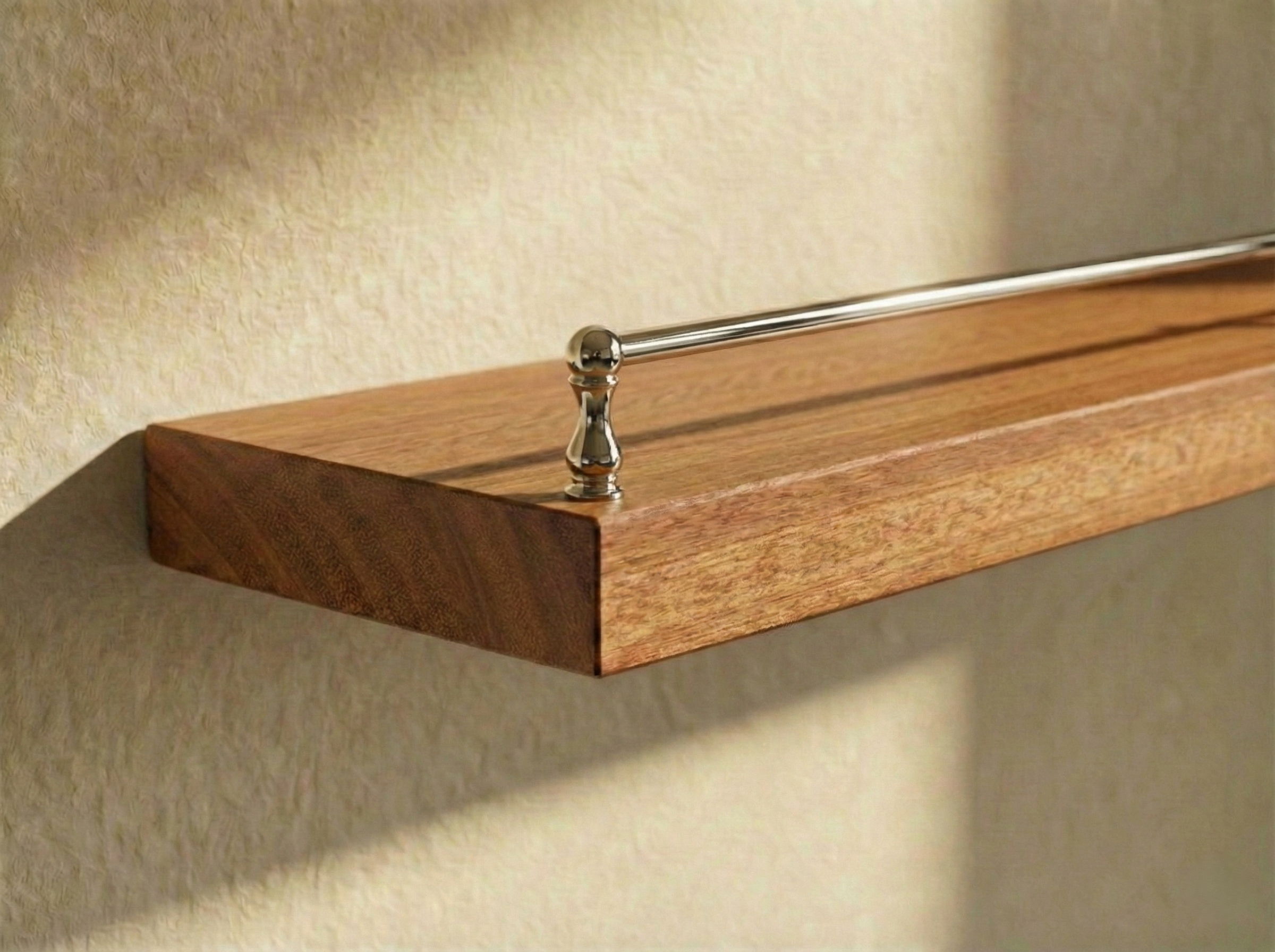 Solid mahogany floating shelf with gallery rail, featuring a sleek design and sturdy construction for stylish wall storage.