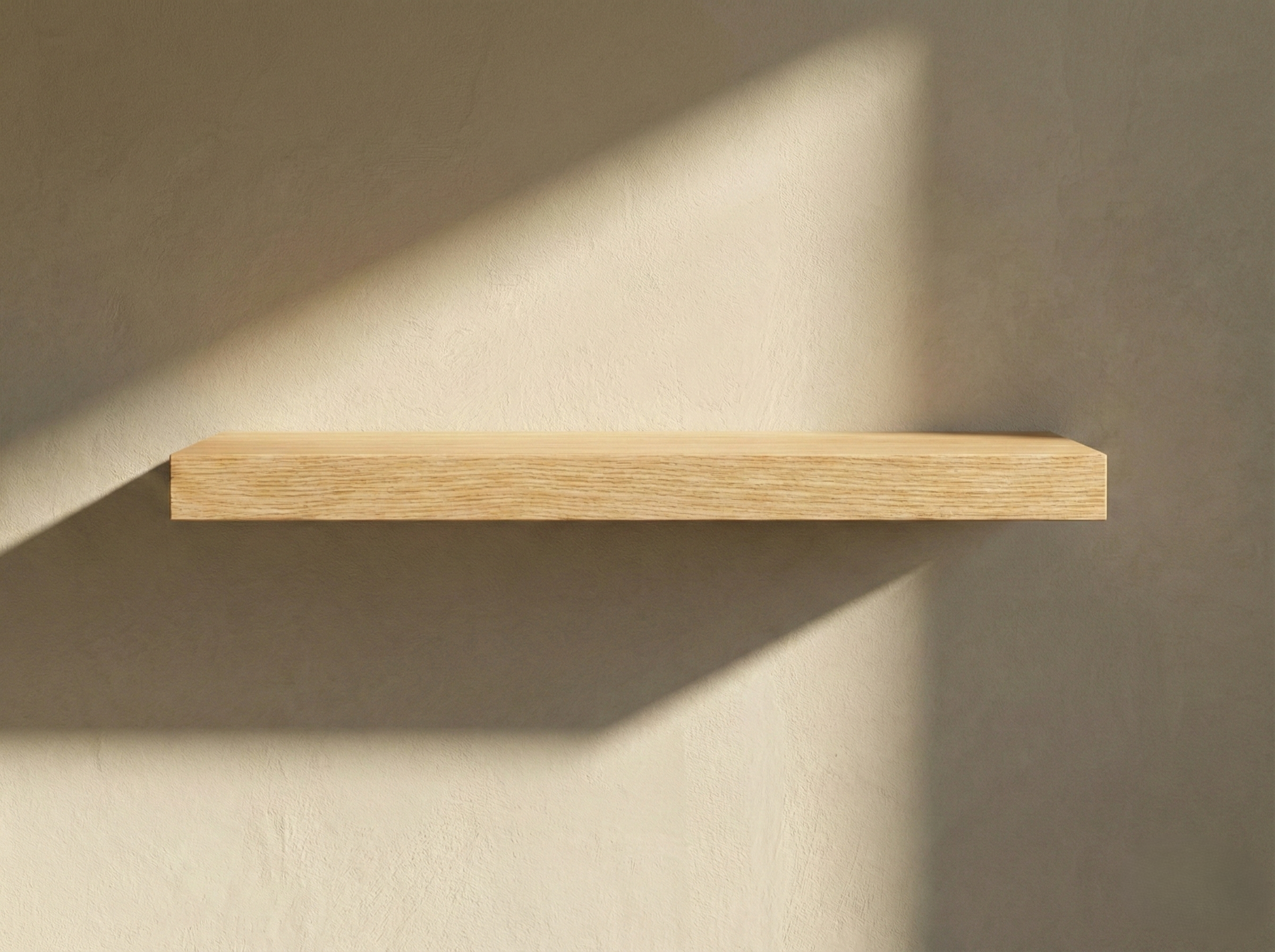 Solid white oak floating shelf by The Mortise & The Hare mounted on a wall, showcasing a clean, modern design.