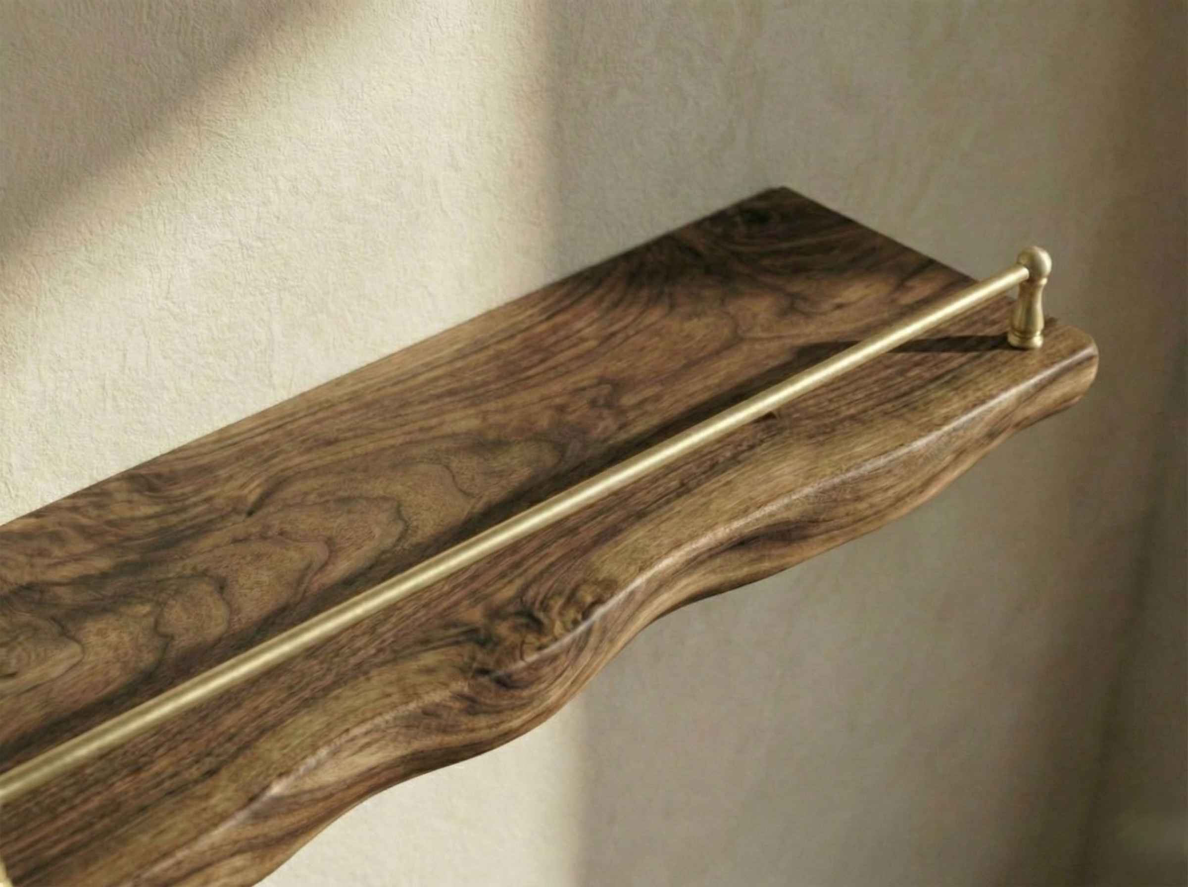 Solid walnut floating shelf with gallery rail, featuring a live edge design from The Mortise & The Hare.