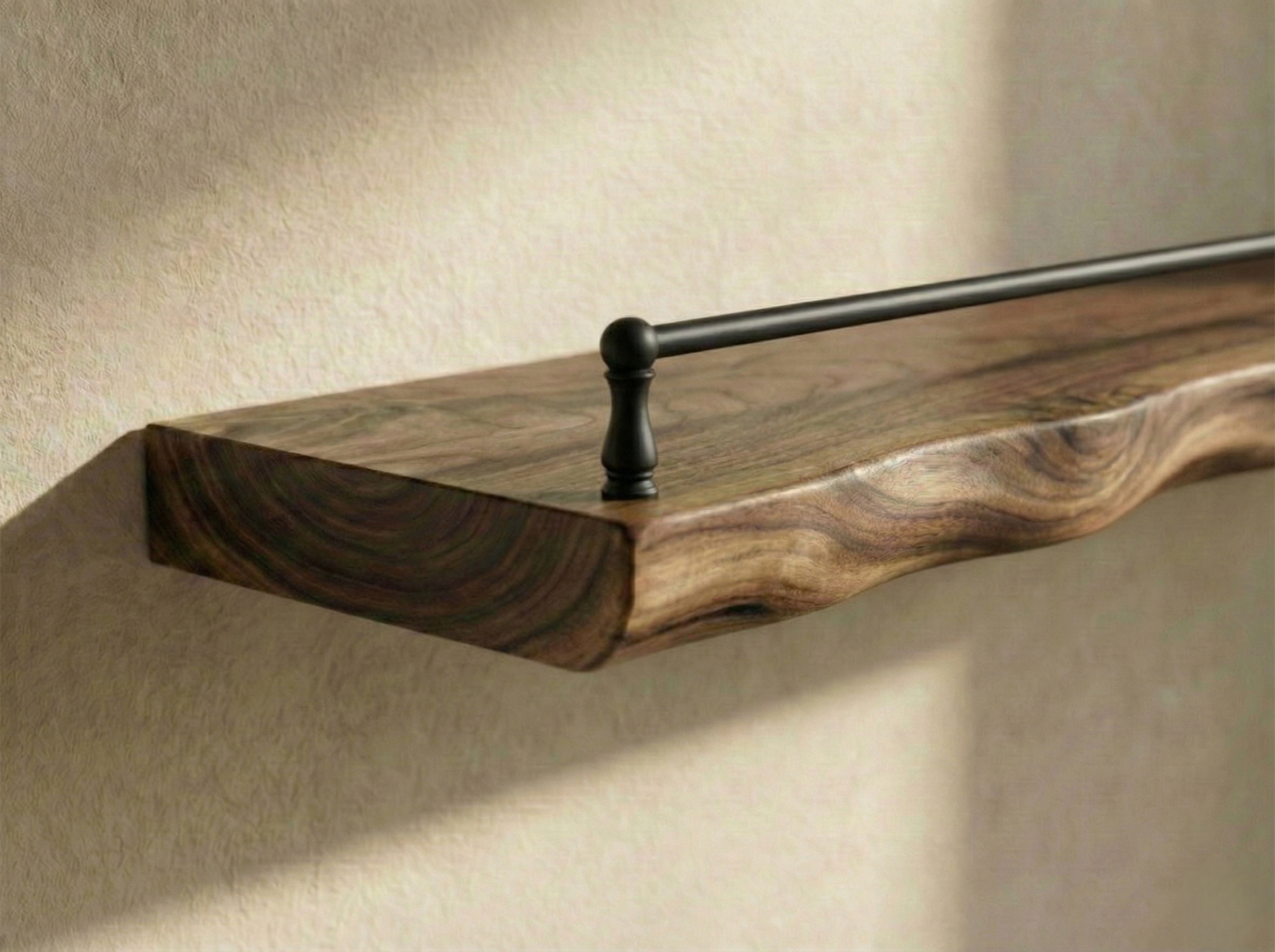 Solid walnut floating shelf with live edge and gallery rail, designed by The Mortise & The Hare for stylish wall storage.