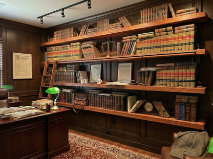Solid red oak floating shelf by Shelving, showcasing a rich wood grain and sleek design for modern home decor.