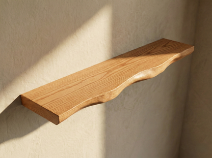 Solid red oak live edge floating shelf showcasing natural wood grain and unique shape for modern home decor.