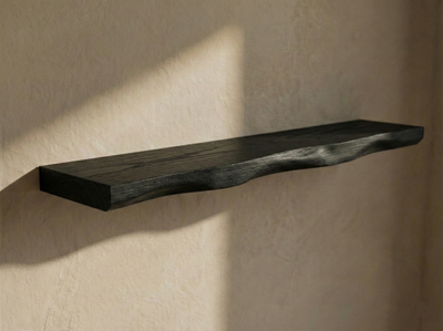 Solid black oak live edge floating shelf by Shelving, showing a natural wood finish and sleek wall-mounted design.