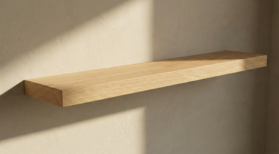 Solid white oak floating shelf by The Mortise & The Hare, showing a sleek, minimalist design with visible wall mounting brackets.