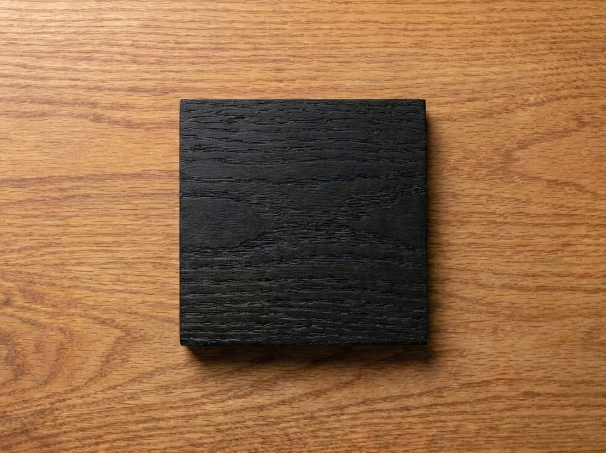 Black Oak hardwood sample from The Mortise & The Hare displaying rich grain and deep color variations.