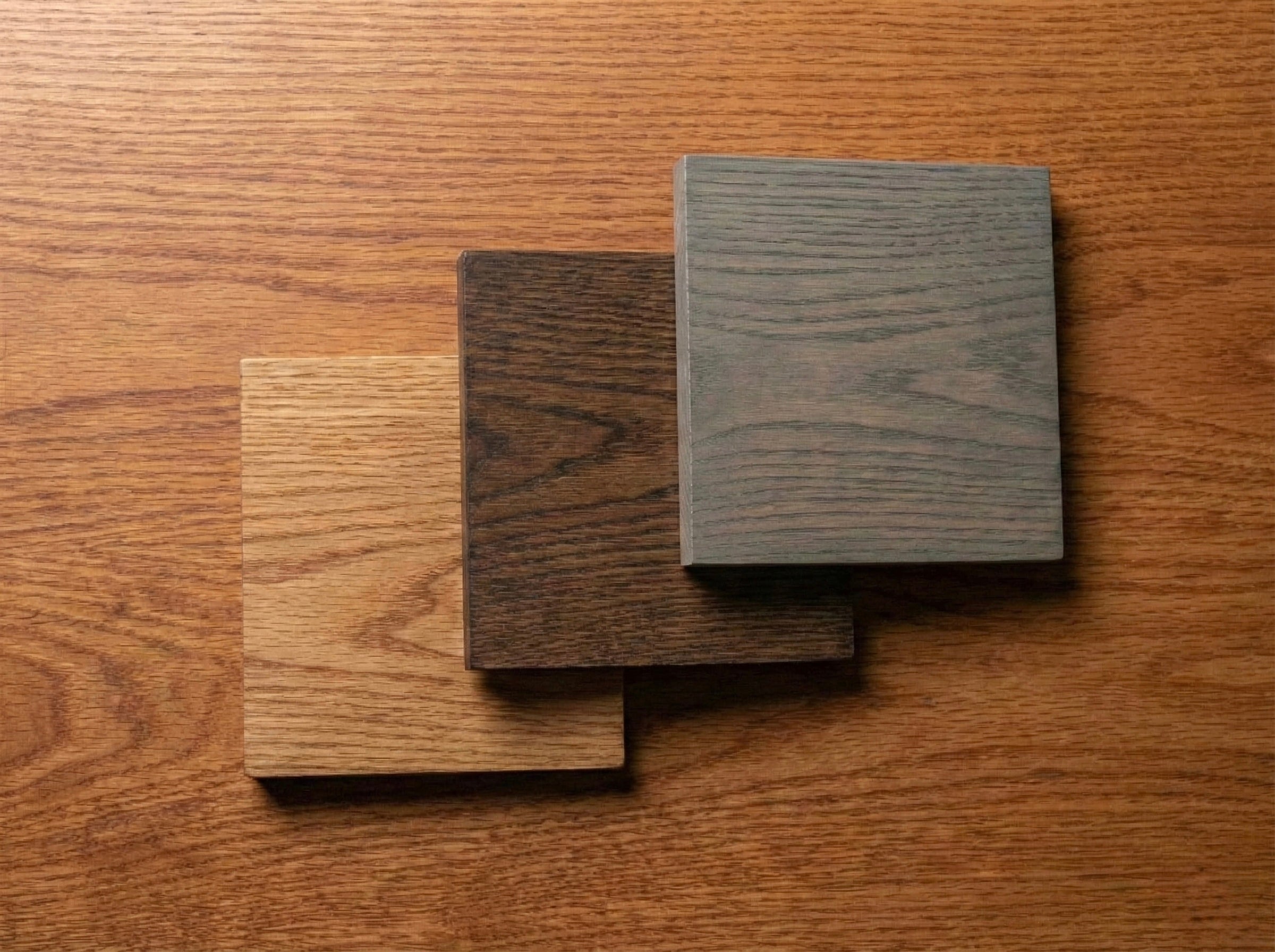 Red Oak hardwood sample by The Mortise & The Hare showcasing rich grain and warm tones on a natural wood surface.
