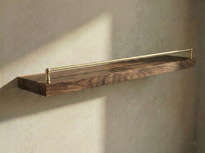 Solid walnut floating shelf with a gallery rail, showcasing a sleek design and rich wood grain texture.
