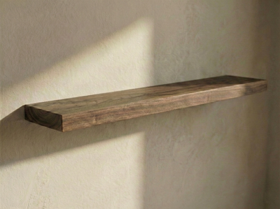 Solid walnut floating shelf by The Mortise & The Hare, showcasing a sleek design and rich wood grain details.